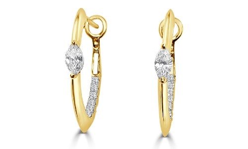 Yellow gold hoops set with diamonds from Frederic Sage