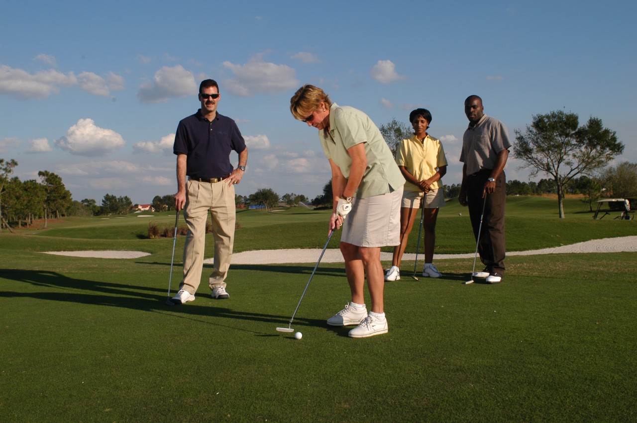 couples playing golf for Father's Day after shopping and spending $1999 or more at Huntington Fine Jewelers