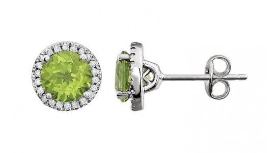 A pair of peridot halo stud earrings in a silver setting