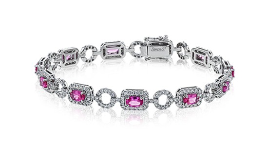 A silver station bracelet by Simon G. with spinel stones and diamond accents
