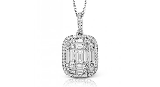 An oversized diamond pendant necklace in a silver setting