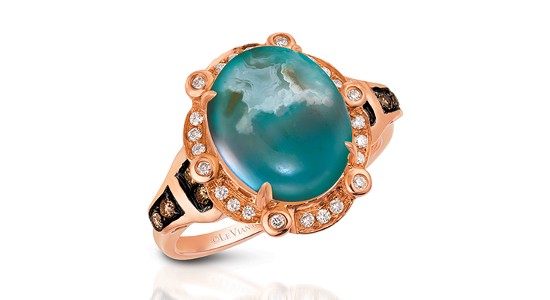 A large, aquamarine fashion ring set in bright strawberry gold