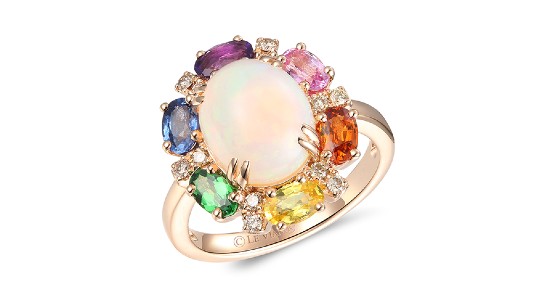 a rose gold fashion ring featuring an opal surrounded by a myriad of colorful gems