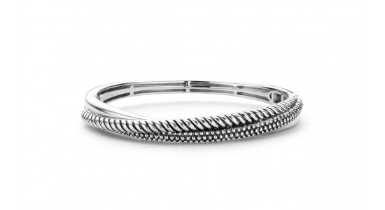 a white gold bangle bracelet featuring multiple different textures