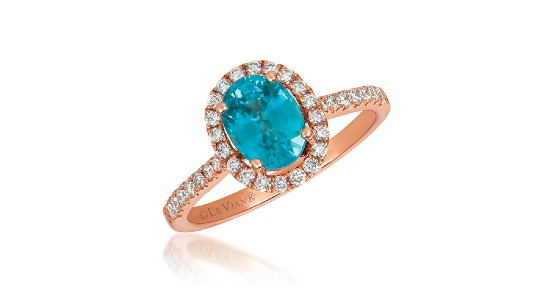 an oval cut zircon in a strawberry gold halo ring setting