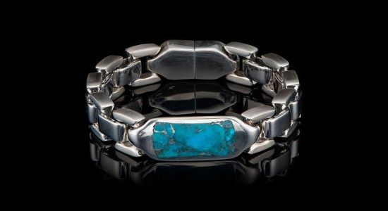 a silver men’s chain bracelet featuring a rectangular-shaped turquoise