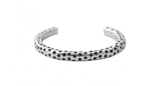 a silver cuff bracelet with black stars