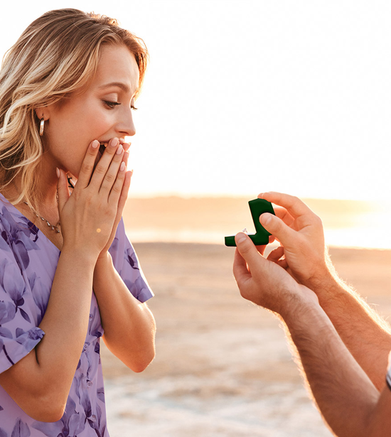 Woman Being Proposed to on the Beach