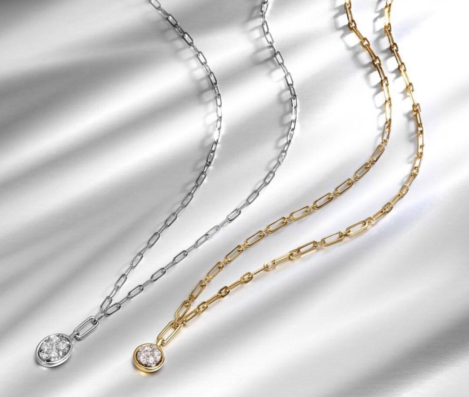 Silver and gold necklaces with diamond center stones