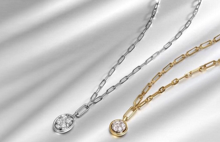 Silver and gold necklaces with diamond center stones