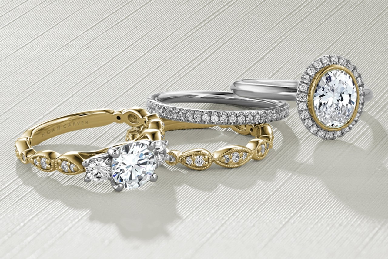 two diamond engagement rings and two wedding bands by Noam Carver