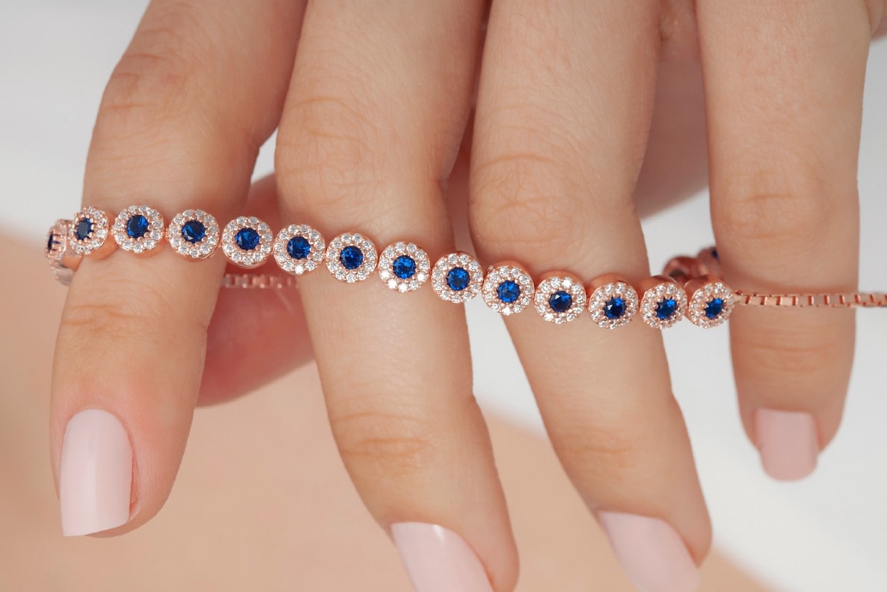 a rose gold bracelet featuring sapphire and diamonds