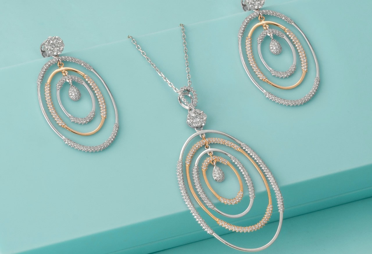 Necklaces with dazzling and complex pendants exhibiting white and yellow gold